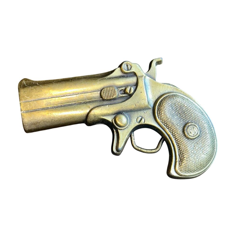 Vintage brass tone derringer pistol belt buckle